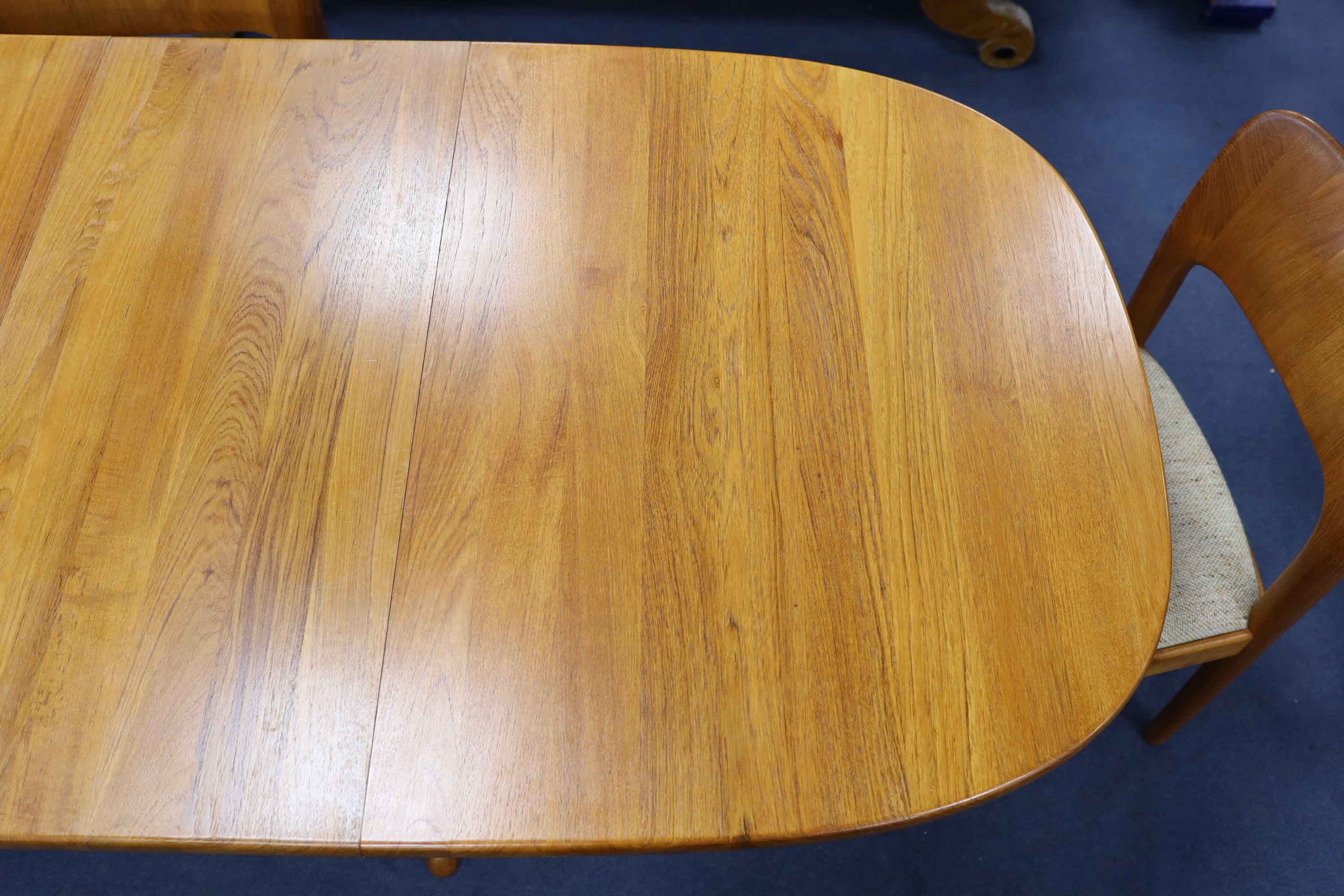 Mid century design. A Niels Koeford Danish teak extending dining table and four chairs, 222cm extended, width 89cm, height 73cm